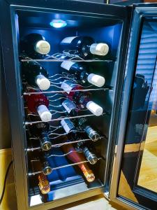 a refrigerator filled with lots of wine bottles at Rosé de Lux in Bogács