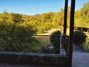 a view of a garden from a balcony at Anicca Posada in San Marcos Sierras +14 photos