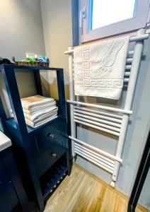 a closet with a towel rack and a drawer at Rosé de Lux in Bogács