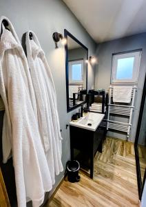 a bathroom with a sink and a mirror at Rosé de Lux in Bogács +29 photos