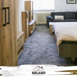Tempat tidur dalam kamar di Milano Apartman ****