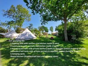 a flyer for a camping site with tents and a tree at Bell tent Glamping Essenhof in Aagtekerke