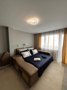 Postel nebo postele na pokoji v ubytování Сютка View Penthouse