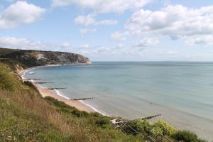 a view of the beach from a hill at Host & Stay - Old Harry Rocks in Swanage