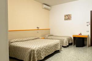 Postel nebo postele na pokoji v ubytování B&B Vittoria