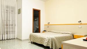 Postel nebo postele na pokoji v ubytování B&B Vittoria