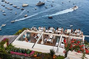 a deck of a boat with people on the water at Hotel Montemare in Positano