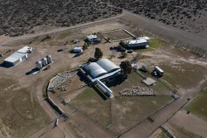 an aerial view of a farm with a building at Estancia TATAY in Trelew