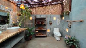 a bathroom with a sink and a toilet at Why Nam Beach in Haad Yuan