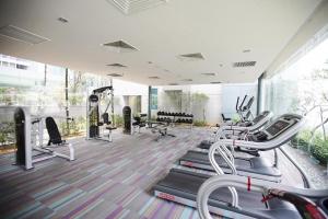 a gym with treadmills and elliptical machines at KLCC Dorm (7 min walking to Twin Towers) in Kuala Lumpur