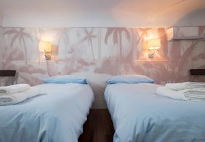 Posteľ alebo postele v izbe v ubytovaní Casa Orchidea - The Fab Stay