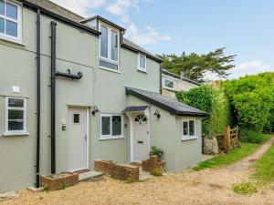 an exterior view of a house with a driveway at 1 Bed in Charmouth 87528 in Charmouth