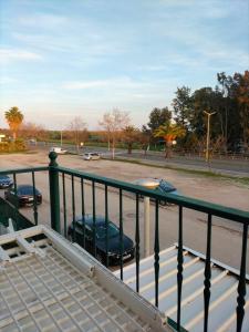 a balcony with cars parked in a parking lot at Apartamento Alagoa Azul in Altura