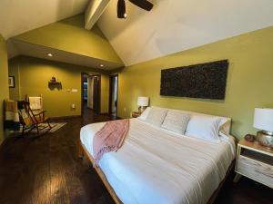 a bedroom with a large white bed in a room at Lepista Landing Family Home Near Downtown KFalls in Klamath Falls