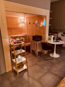 a kitchen with a table and two tables and a stove at Golden Key Apartments in Liberec