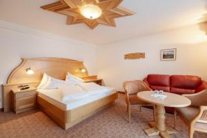 Postel nebo postele na pokoji v ubytování Piccolo Hotel