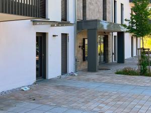 a building with a walkway in front of a building at AD1716 Apartments in Marktheidenfeld