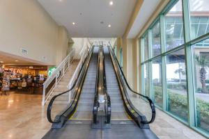 an empty escalator in a shopping mall at Emerald Beach by Panhandle Getaways in Panama City Beach