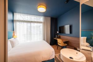 Hôtel de la Cité客房内的一张或多张床位