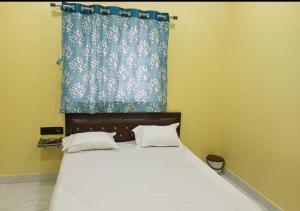 Krevet ili kreveti u jedinici u okviru objekta Hotal Raj Guest House