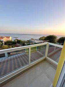 a balcony with a view of the ocean at Cidade Velha - Cathedral and Sea view - 1Bdr Apart - 2 in Cidade Velha