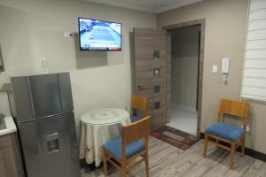 TV a/nebo společenská místnost v ubytování TEYFA Hospedaje - Edificio