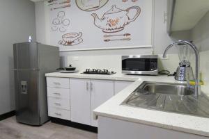 Kuchyň nebo kuchyňský kout v ubytování TEYFA Hospedaje - Edificio