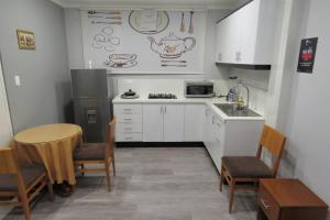Kuchyň nebo kuchyňský kout v ubytování TEYFA Hospedaje - Edificio
