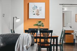 a dining room with a table and chairs at NEW Great Escape 404 2BR Condo Near Downtown and Bay in Traverse City