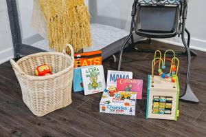 a basket and books on the floor next to a mirror at NEW Great Escape 404 2BR Condo Near Downtown and Bay in Traverse City +57 photos