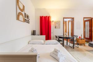 a bedroom with a bed and a table in a room at Rucellai Studio With Shared Pool by Halldis in Milan +19 photos