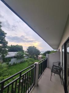 a balcony with a view of a river at Merpati inn hotel in Dompu