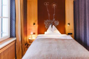 Postel nebo postele na pokoji v ubytování Boutique-Hotel Schmelzhof