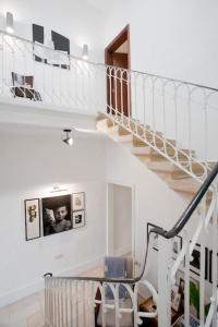 a spiral staircase in a house with a baby at THE AUTHENTIC TOWNHOUSE in St Paul's Bay