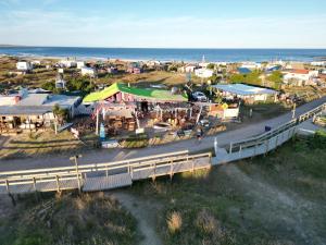 an aerial view of a small town with a bridge at Lobo Hostel Bar in Cabo Polonio