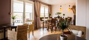a dining room with a table and chairs at Kyriad Montargis Amilly in Amilly