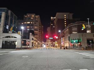 an empty city street at night with a red traffic light at Private romantic apartment in fellspoint 2min from fellspoint night bars in Baltimore