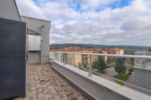 a balcony with a view of a city at Derio Aeropuerto in Derio