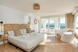 a living room with a bed and a couch at Villa near San Antonio in San Antonio
