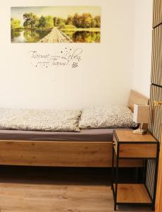 a bed in a room with a picture on the wall at Apartment Andreas Bichler in Weistrach