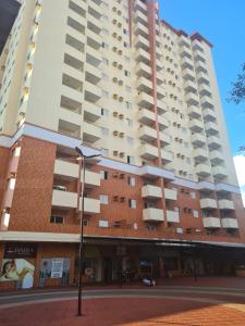 a large building with balconies on the side of it at Edifício Belluno in Ribeirão Preto