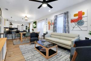 a living room with a couch and a table at Artsy - A Birdy Vacation Rental in San Antonio