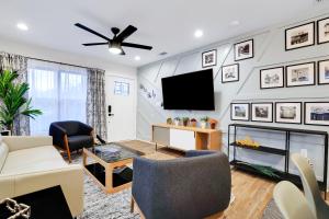 a living room with a tv and a fireplace at Artsy - A Birdy Vacation Rental in San Antonio