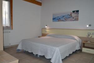 Posteľ alebo postele v izbe v ubytovaní Agriturismo la Ghiandaia Alghero