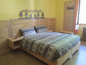 Postelja oz. postelje v sobi nastanitve Albergo Rotenthal