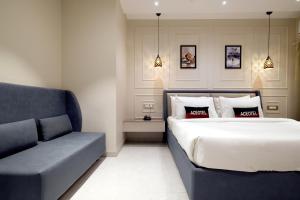 Posteľ alebo postele v izbe v ubytovaní Aceotel Select Tulsi Vijay Nagar