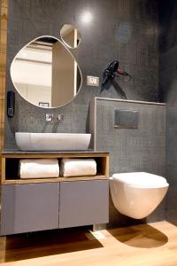 a bathroom with a sink and a mirror at Aceotel Select Tulsi Vijay Nagar in Indore