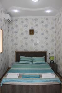 Postel nebo postele na pokoji v ubytování Kutaisi Best Guest House
