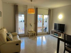 Μια τηλεόραση ή/και κέντρο ψυχαγωγίας στο Còmode apartament al bell mig de Girona