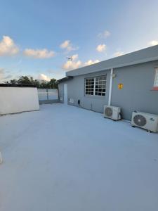 a large parking lot in front of a building at MF Vacation Homes Villa 2 in Loiza